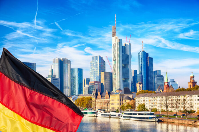 Skyline cityscape of Frankfurt Germany during sunny day with german flag Frankfurt Main in a financial capital of Europe