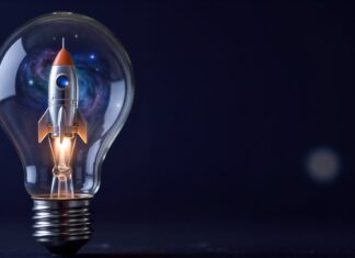 První investice nového evropského fondu směřuje do finského vesmírného start-upu Rocket inside a glass light bulb against a dark background, symbolizing bright ideas and space exploration.